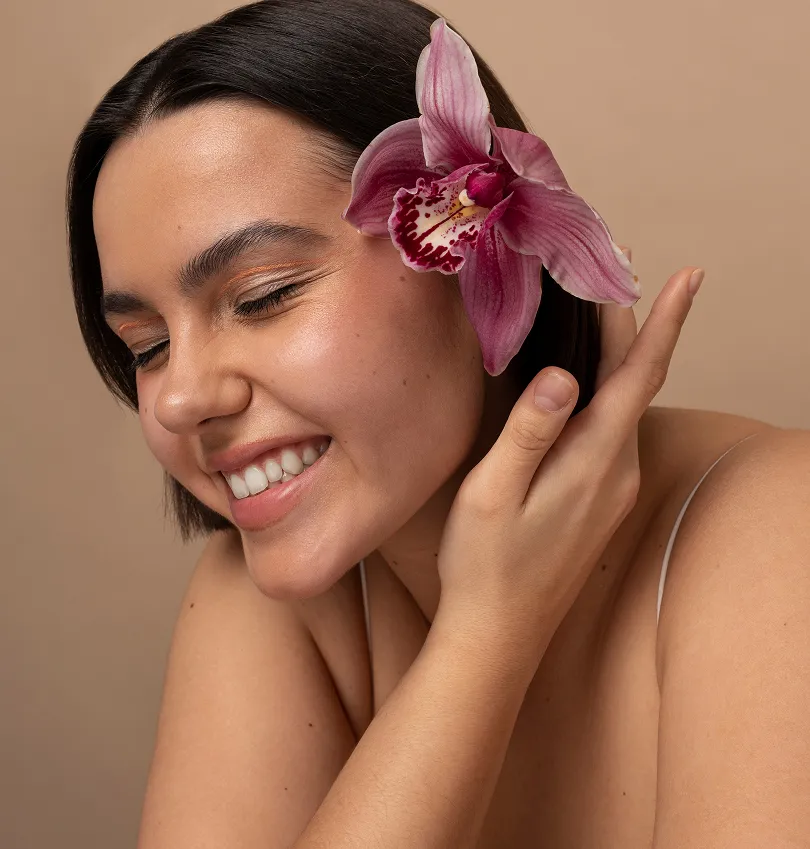 Smiling woman with a flower in her hair